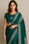 Emerald green pre-draped chiffon saree with silver zari embroidery
