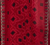 Close-up of Bandhini print and zari border on red chiffon georgette saree