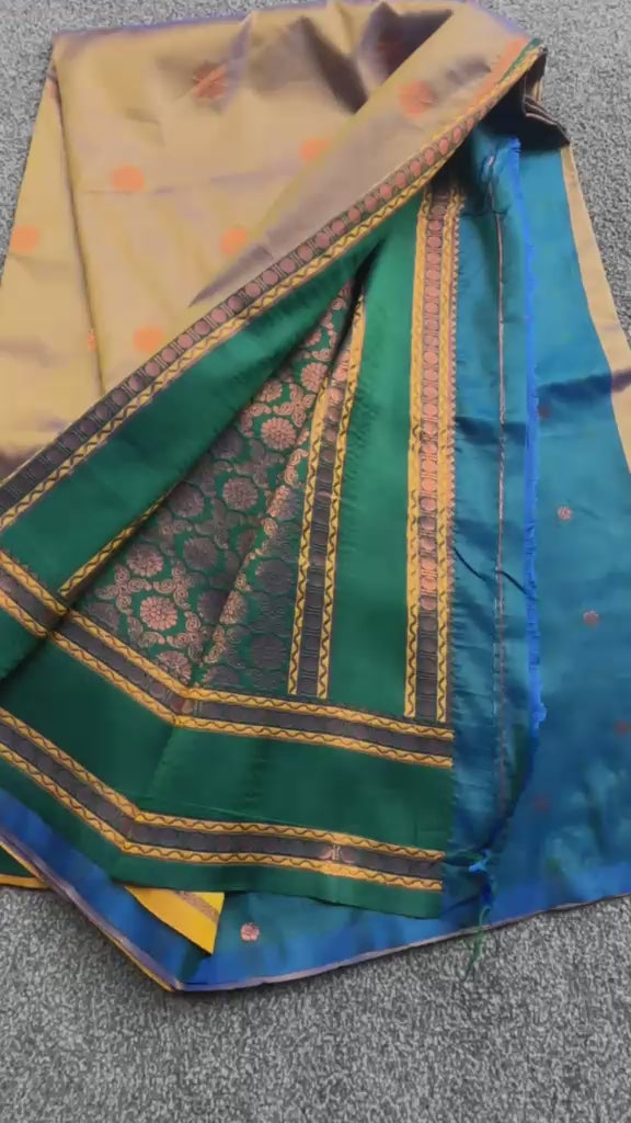 Elegant slow drape collection soft silk saree with traditional zari weaving, emerald borders and fluid lightweight drape.
